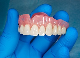 Dentures are made of a variety of materials including acrylic and porcelain