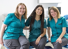 Three female dental receptionists