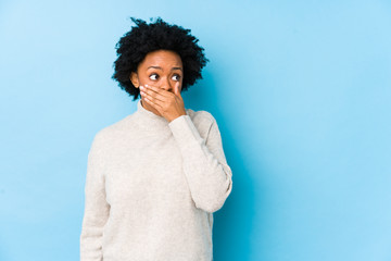 person with lost dental crown covering mouth with hands