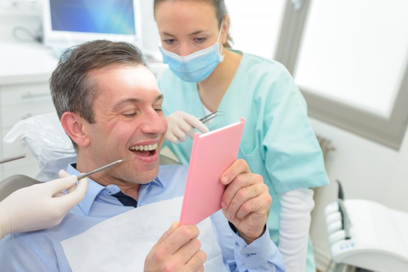 Patient talking to dentist about veneers